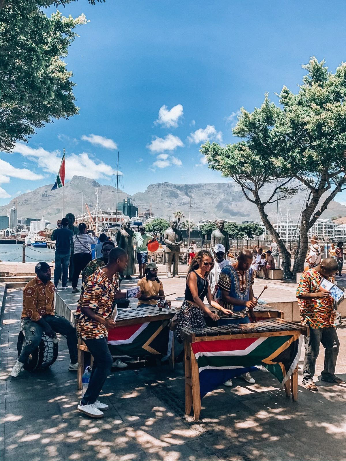 Marimba players on the Cape Town waterfront beneath Table Mountain