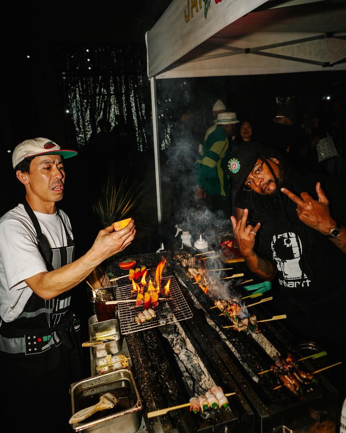 Chefs and friends around the grill after service